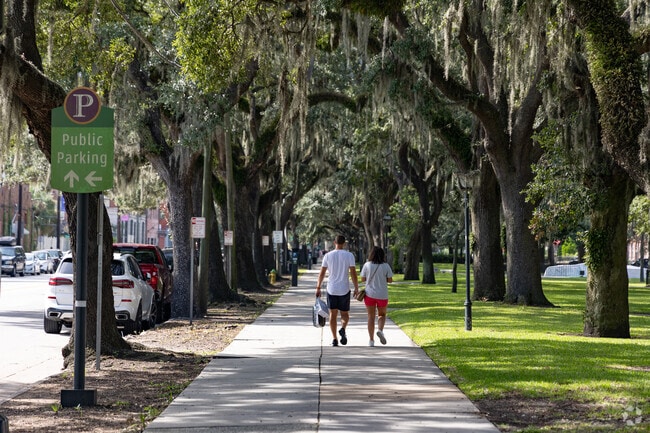 Residents of Hitch Village-Fred Wessels walk the historic streets of Downtown Savannah.