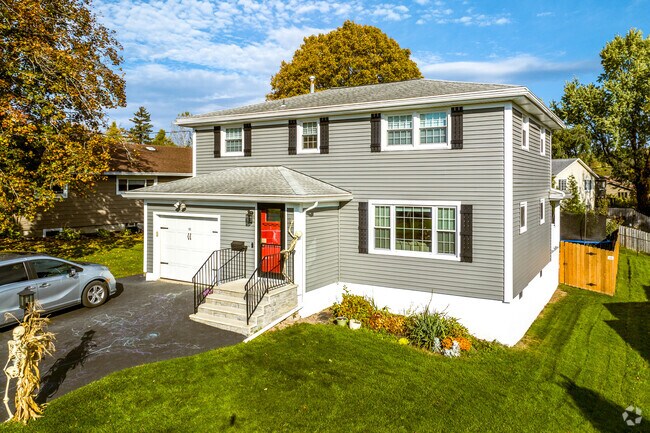 Hipped, gabled homes in Jamesville adorn tree-lined streets.