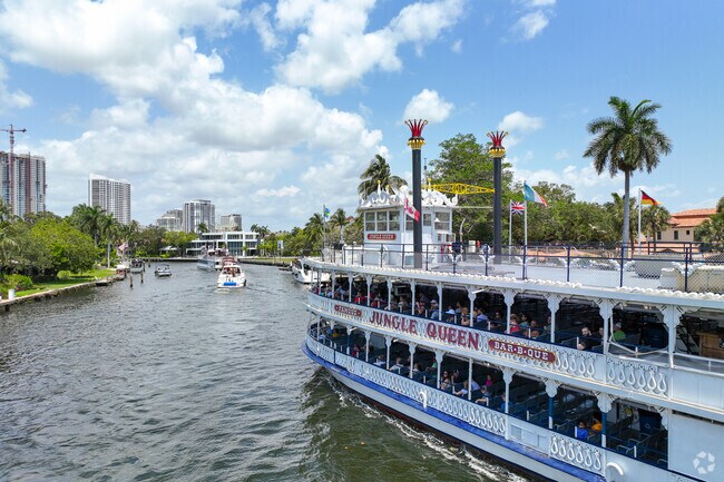 Jungle Queen tourist boat is passing through the New River by Colee Hammock neighborhood.