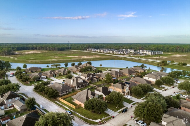 Residents enjoy fishing and tranquil pond views a short walk from Valley Ranch homes.