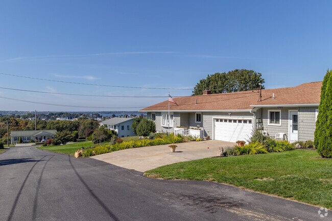 A row of ranch homes in the Tiverton neighborhood is part of a mid-century suburban enclave.