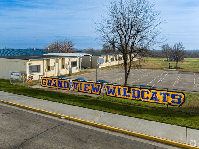 A large sign greets students at the entrance to Grand View Elementary School.