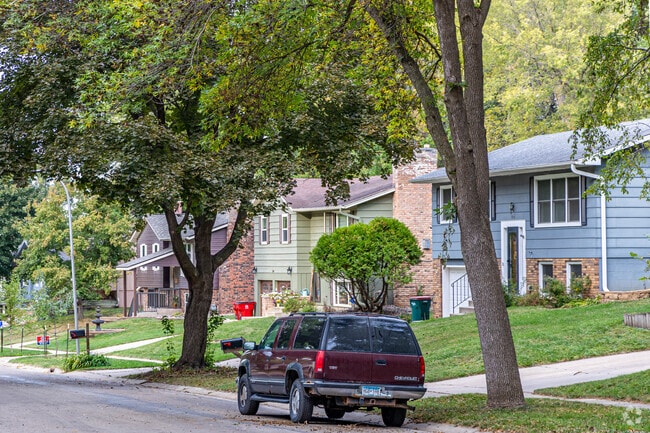 Homes in Washington sit along tree-lined sidewalks with access to a street park.