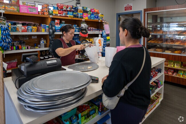Anticipating her delicious treat at Santa Rosa bakery, this lady eagerly awaits her order.