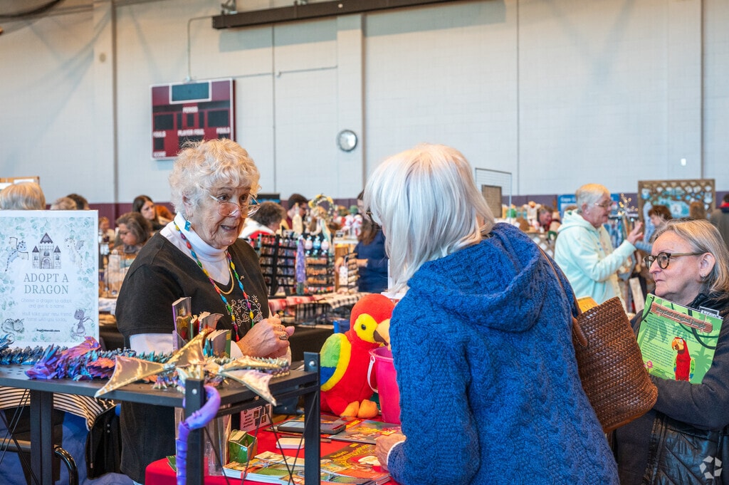 A local author discusses her books with customers.