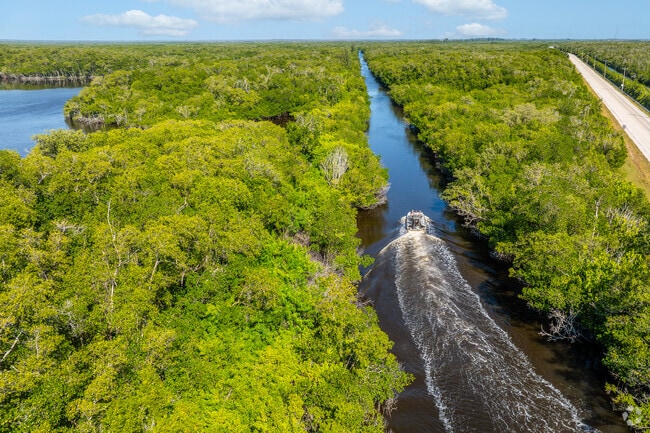 Boats navigate scenic waterways near Everglades City and Big Cypress Preserve.