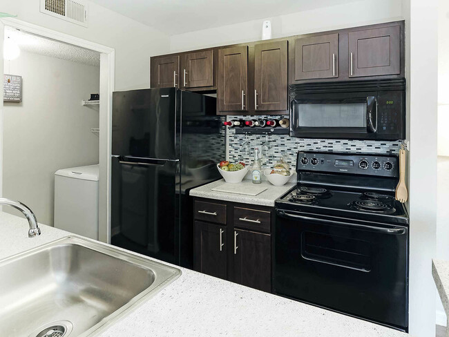 Experience the elegance of this contemporary kitchen, combining style with functionality.