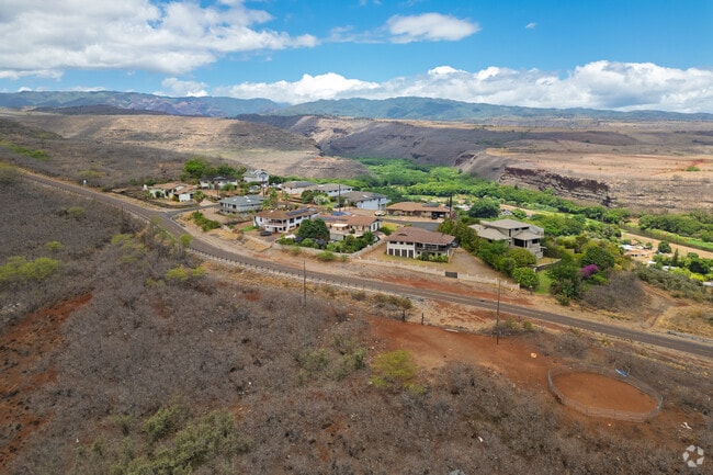 Luxury homes dot the ridges above Waimea Canyon.