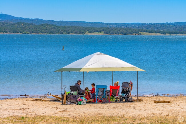 Family gathers at Granite Bay Beach at Folsom Lake near Olympus Pointe to enjoy the weather.