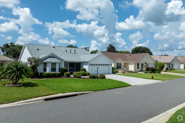 Village of Belvedere offers a variety of ranch style homes with lush green lawns.
