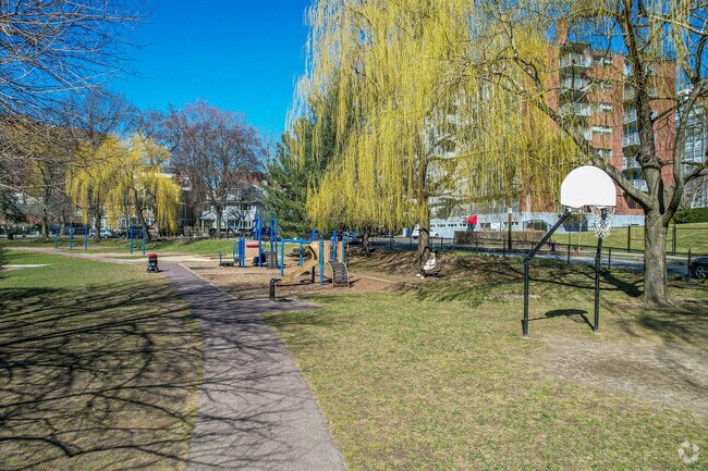 Playground and grass basketball court in Griggs Park.