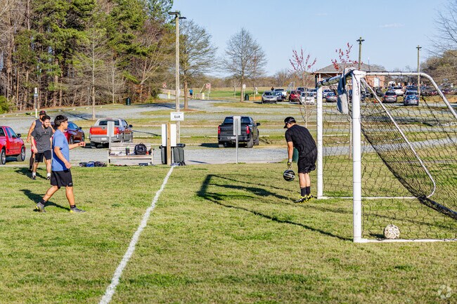 Friends at Ritters Lake join a pickup soccer game.