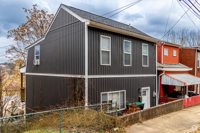 Homes in Millvale can be lined across steep hillsides above the main downtown drag.