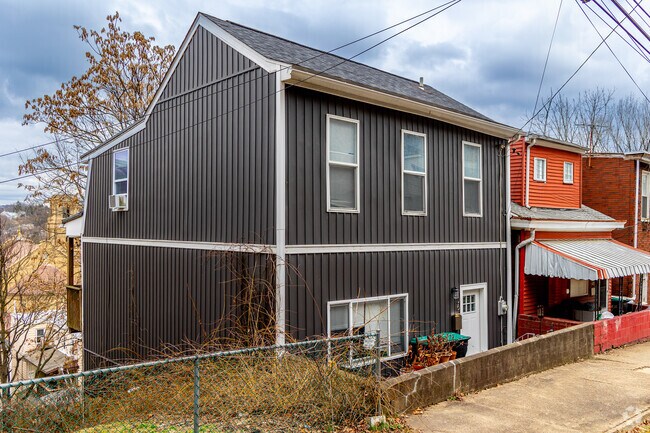 Homes in Millvale can be lined across steep hillsides above the main downtown drag.