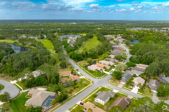 Indigo is a suburban neighborhood dotted with mature trees and tranquil lakes.
