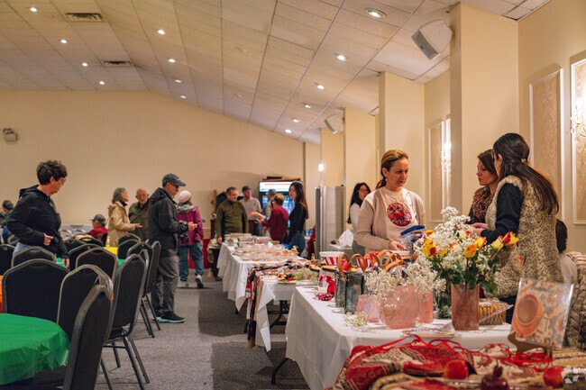 Families get together to enjoy the traditions of the 75th Annual Food Festival Bazaar.