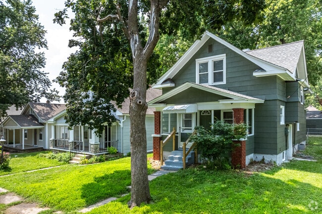 Bungalow and craftsman homes line the streets of Procter and are shaded by large mature trees.