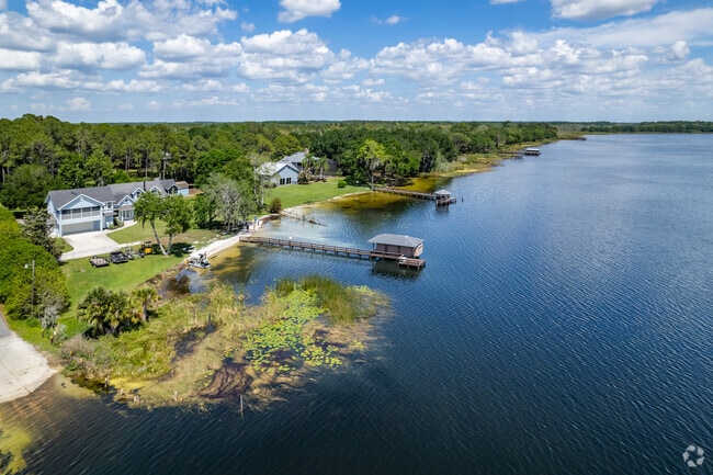 A beautiful large blue home on the water in Lake Yale.