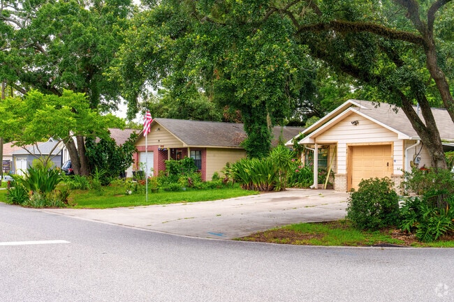 A row of Taft homes features lush landscaping and mature trees for shade and privacy.