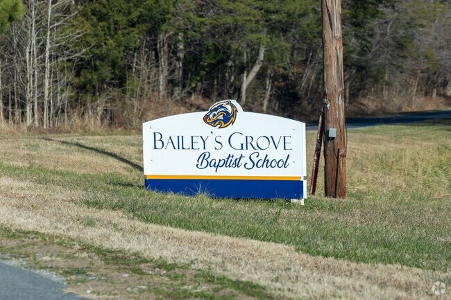 Sign at the entrance to Bailey's Grove Baptist School.