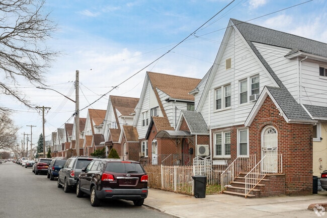 A row of semi-detached Queen Anne houses, flatlands, for single family living.