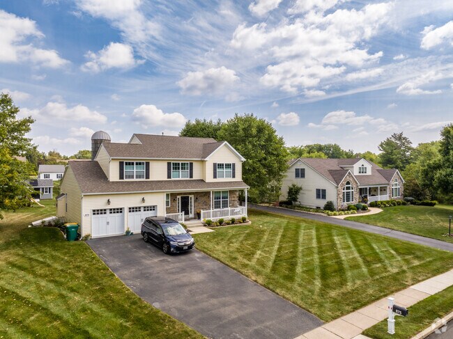 Enjoy privacy on the front porch of your lovely two-story home in Upper Gwynedd Township.