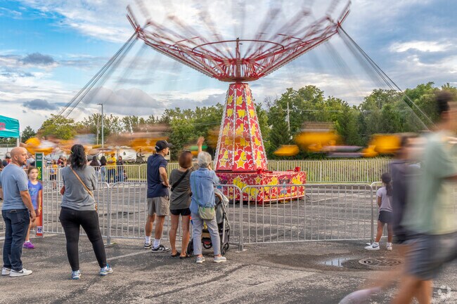 Parents of Horatio Gardens get to watch their kids spun around on the carnival rides.