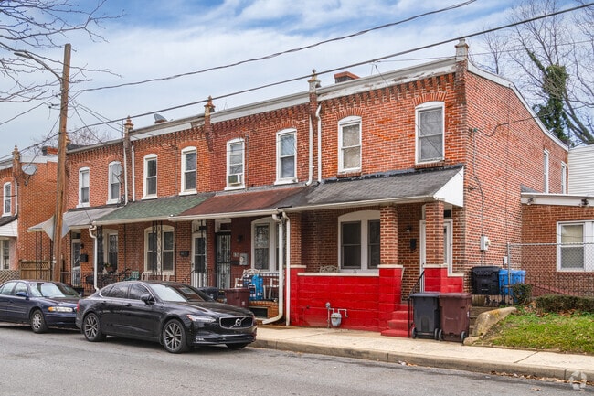 Brick rowhomes in South Wilmington often have small front porches with ample street parking.