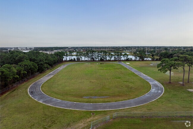 Exercising at Ronald McNair Magnet Middle School, children relish a serene view.
