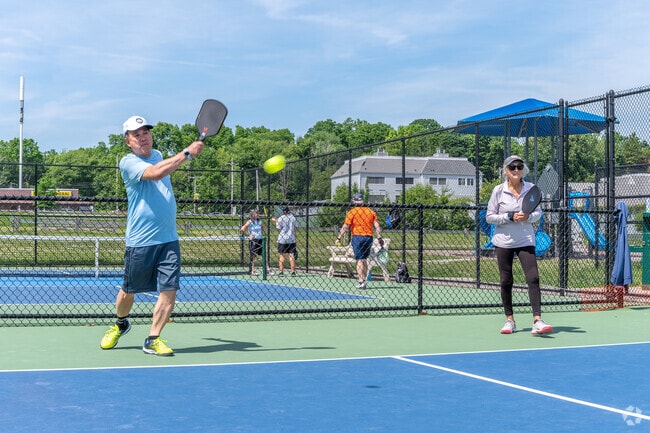 Locals enjoy a game of pickleball at Howard Park in Woodmont.