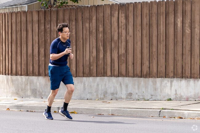Morning jogs are a daily rhythm on the quiet, shaded sidewalks of the Citaldi neighborhood.