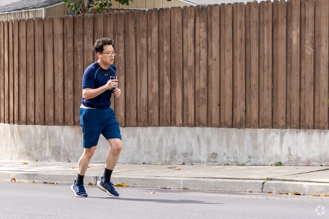 Morning jogs are a daily rhythm on the quiet, shaded sidewalks of the Citaldi neighborhood.