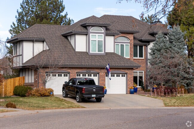 This home in Heritage Greens features amazing brick work and a three car garage.