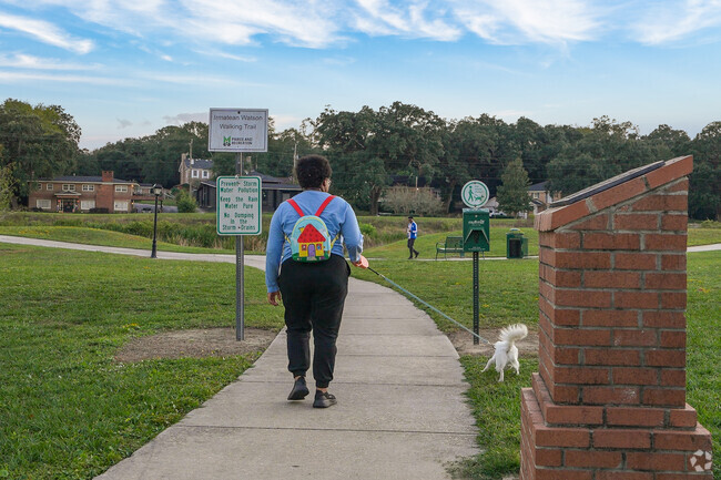 Visitors of Owen's Tricentennial Park can take a stroll with furry friends on the paved paths.