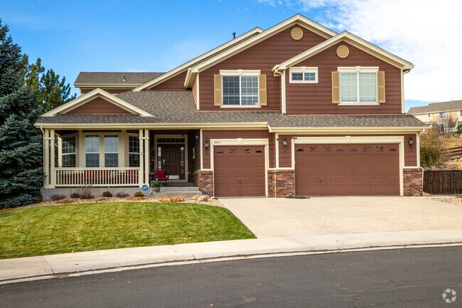 Two-story homes with three-car garages line Sapphire Pointe in Castle Rock.