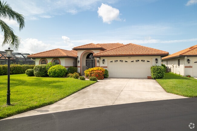 Venice Gardens single family home with Mediteranean influences, rounded arches and tile roof.