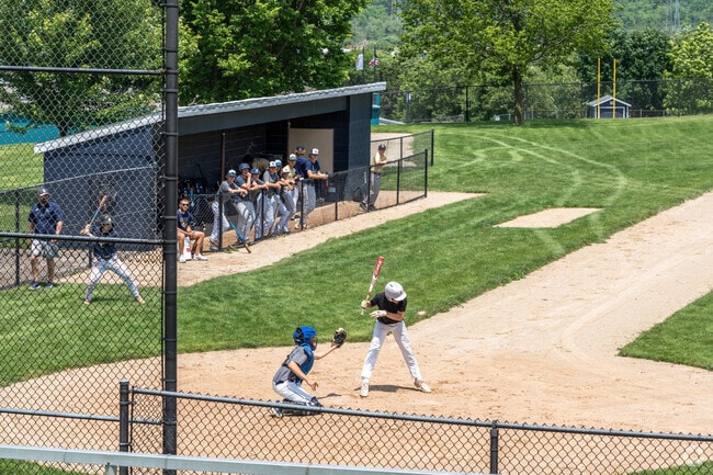 A batter gets brushed back during a baseball scrimmage at Lemont High School.
