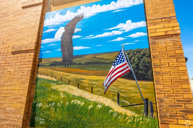 A downtown mural shows the peaceful countryside around Guthrie Center and Guthrie County.