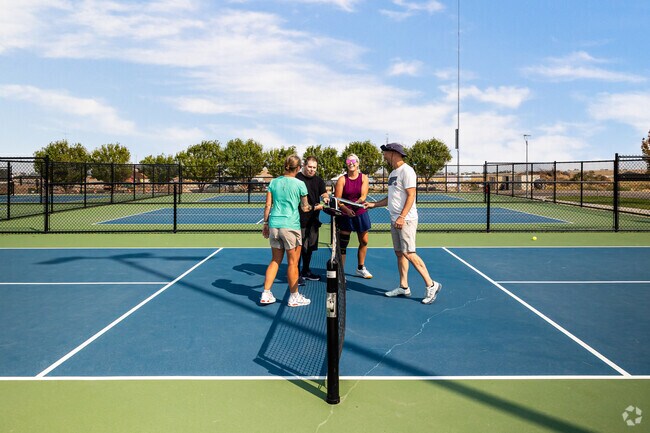 Friends enjoy an active afternoon at Sierra Newbold Pickleball Court in Cobble Creek.