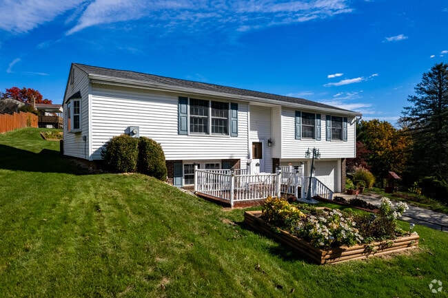 Split-level homes in North Huntingdon are built on green hills.