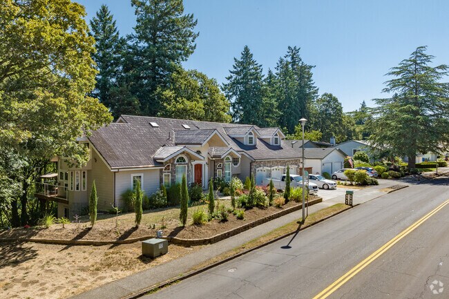 A modest millennia mansion backs up to Burnt Creek Greenway in Northwest Vancouver.