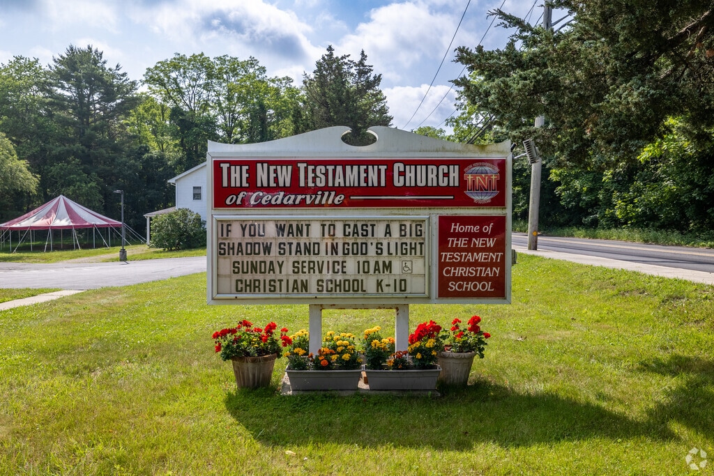 An announcement board greets you to New Testament Christian School.