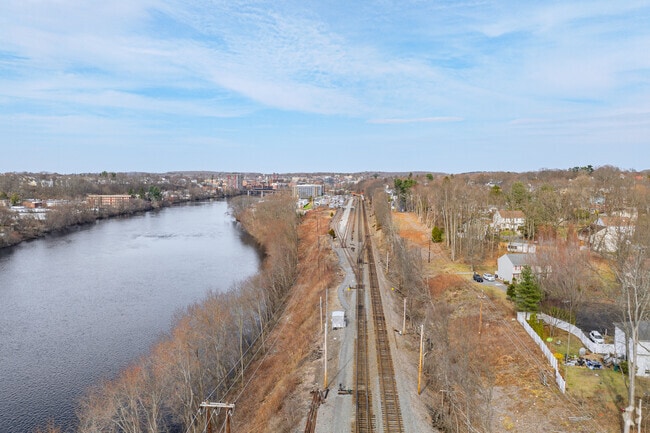 The rail line that runs through the north of Central Bradford and is adjacent to the Merrimack River is a unique characteristic of the community.
