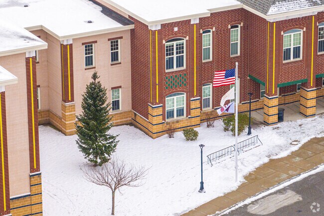 A proud pole of flags greets you at the entrance of Villa Nova Middle School in Woonsocket, RI.