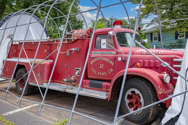 An antique Bradley Gardens firetruck sits outside the volunteer fire department.
