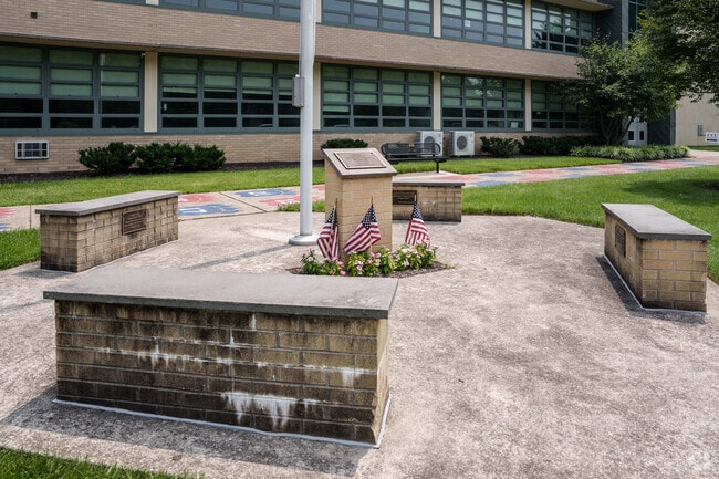 A memorial to a graduate who was lost on 9/11 stands in front of Cardinal O'Hara High School.