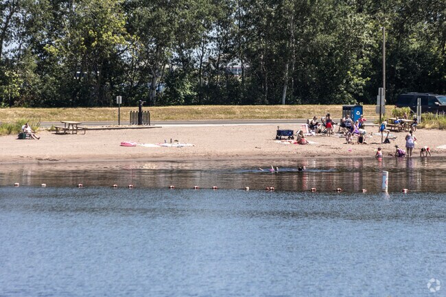 Barker's Island Beach is a small lagoon for swimming and sunbathing in Wisconsin.