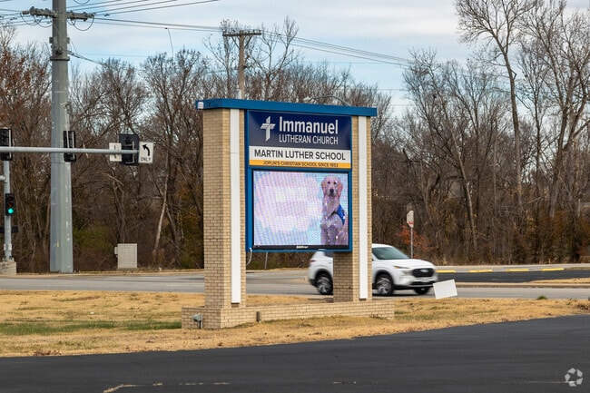 You will find a sign for Martin Luther School near the road.