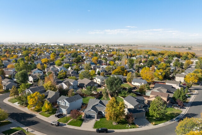 Large trees add charm to the well kept neighborhood of River Run.