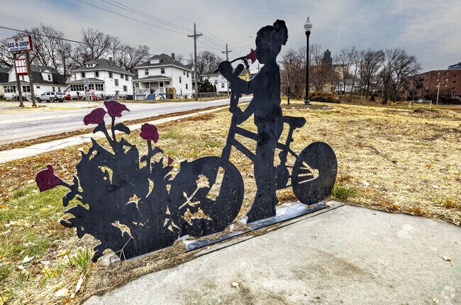 Gifford Park displays neighborhood sculptures along shaded paths.